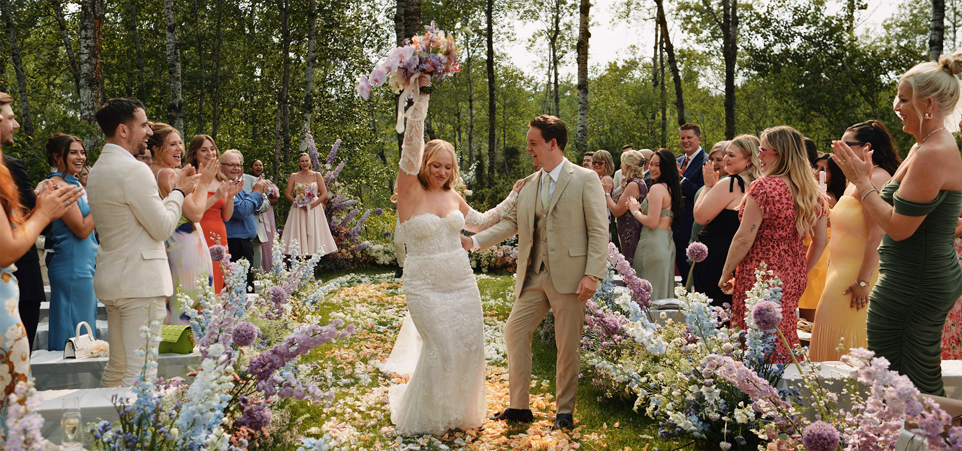 Jeanna dancing down her ceremony aisle at her cottage wedding