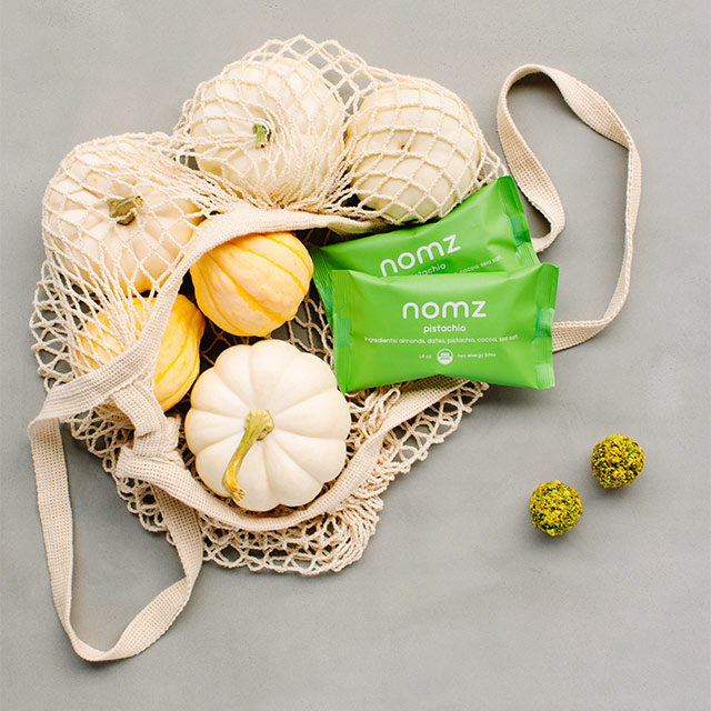 Nomz Pistachio Bites in Fall Setting