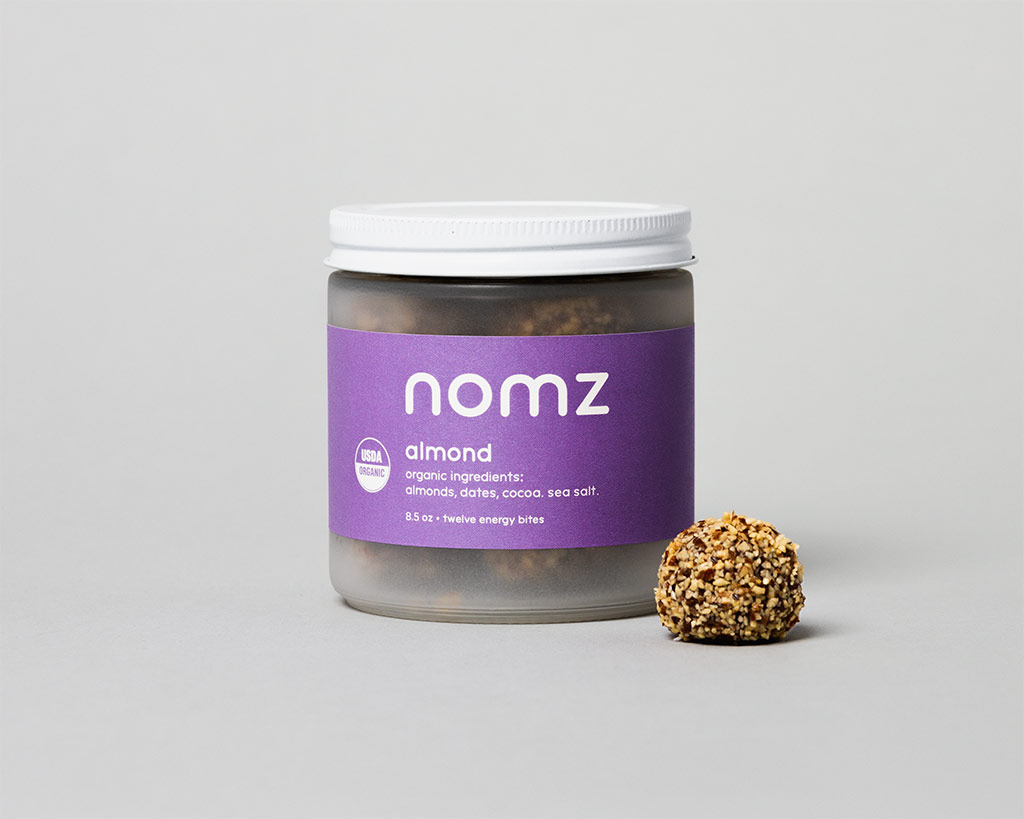 A Nomz Energy Bites jar in the studio